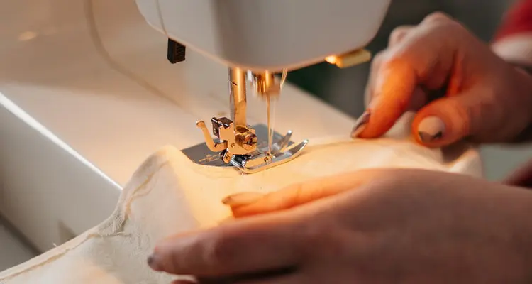 person using sewing machine